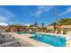 Community pool with plenty of lounge chairs and shade for residents at 9801 W Rockwood Dr, Peoria, AZ 85382
