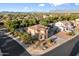Stunning aerial view of a home nestled in a peaceful neighborhood with mountain views at 11048 E Quintana Ave, Mesa, AZ 85212