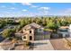 Beautiful aerial view of the home showcasing the landscaping and the surrounding neighborhood at 11048 E Quintana Ave, Mesa, AZ 85212
