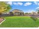 Spacious backyard with lush lawn, perfect for outdoor activities and entertaining at 11048 E Quintana Ave, Mesa, AZ 85212