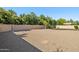 A large backyard featuring desert landscaping, offering a serene and low-maintenance outdoor space at 11048 E Quintana Ave, Mesa, AZ 85212