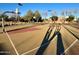 Outdoor basketball court with multiple hoops and well-maintained surface, perfect for recreation at 11048 E Quintana Ave, Mesa, AZ 85212
