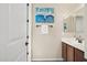 Bathroom featuring modern fixtures, a stylish vanity, and tasteful decor, creating a serene and functional space at 11048 E Quintana Ave, Mesa, AZ 85212