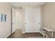 Bedroom with dark floors, a sliding door closet and a desk by the window at 11048 E Quintana Ave, Mesa, AZ 85212