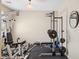 Home gym equipped with weightlifting machines and a bench, perfect for fitness enthusiasts at 11048 E Quintana Ave, Mesa, AZ 85212