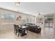 Open-concept living room features a dining area and comfortable seating, perfect for Gathering gatherings at 11048 E Quintana Ave, Mesa, AZ 85212