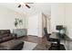 Versatile living space with a sitting area and a dedicated workspace, ideal for both relaxation and productivity at 11048 E Quintana Ave, Mesa, AZ 85212