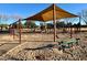 Neighborhood playground with swings, slides, and a covered seating area for parents at 11048 E Quintana Ave, Mesa, AZ 85212