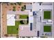 Aerial view of a home with extensive landscaping, including manicured lawns, a Zen garden, and outdoor seating at 11601 N 64Th Pl, Scottsdale, AZ 85254