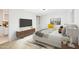 Bright bedroom features ensuite bath, tv, and walk in closet at 11601 N 64Th Pl, Scottsdale, AZ 85254