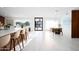 Bright entryway with a modern front door, an open-concept design, and a stylish dining area at 11601 N 64Th Pl, Scottsdale, AZ 85254