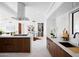 Well-appointed kitchen boasts stone countertops, modern appliances, and stylish backsplash at 11601 N 64Th Pl, Scottsdale, AZ 85254