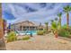 Spacious backyard showcasing a pool, desert landscaping, and comfortable outdoor seating areas at 1217 S Longmore Ct, Chandler, AZ 85286
