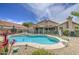 Beautiful backyard with a pool, desert landscaping, and patio, perfect for outdoor enjoyment at 1217 S Longmore Ct, Chandler, AZ 85286
