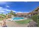 Lush backyard with a sparkling pool, desert landscaping, and inviting patio area for relaxation at 1217 S Longmore Ct, Chandler, AZ 85286
