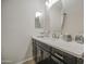 Modern bathroom boasts a sleek vanity with a stylish mirror and a neutral color palette, exuding simplicity and elegance at 1217 S Longmore Ct, Chandler, AZ 85286