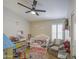 Adorable bedroom offers ample space for play, with natural light from the window and neutral colored walls at 1217 S Longmore Ct, Chandler, AZ 85286