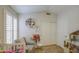 Charming bedroom features a neutral color scheme, plush chair and bright natural light from the window at 1217 S Longmore Ct, Chandler, AZ 85286