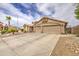 Beige home with a spacious three-car garage and well-maintained landscaping at 1217 S Longmore Ct, Chandler, AZ 85286