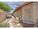 Exterior view of home with spa system, stone pathway, gravel landscaping, and an access gate at 1217 S Longmore Ct, Chandler, AZ 85286
