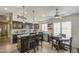 Open kitchen with stainless steel appliances, a kitchen island, and a breakfast nook at 1217 S Longmore Ct, Chandler, AZ 85286