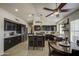 Open kitchen with a breakfast nook featuring dark wood cabinets and stainless steel appliances at 1217 S Longmore Ct, Chandler, AZ 85286