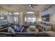 Open-plan living room with hardwood floors, a leather sofa, and bright, natural light at 1217 S Longmore Ct, Chandler, AZ 85286