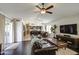 Spacious living room showcasing hardwood floors, an open floor plan, and abundant natural light at 1217 S Longmore Ct, Chandler, AZ 85286
