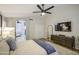 Relaxing main bedroom with attached ensuite bathroom featuring a bathtub, and a ceiling fan at 1217 S Longmore Ct, Chandler, AZ 85286