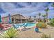 Inviting pool surrounded by desert landscaping, seating, and lush plants, creating a tranquil retreat at 1217 S Longmore Ct, Chandler, AZ 85286