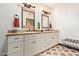 Charming bathroom with dual sinks, granite countertop, stylish mirrors, and patterned tile floors at 1235 N Sunnyvale -- # 113, Mesa, AZ 85205