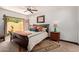 Bedroom featuring a wooden bed frame and direct access to a private outdoor patio at 1235 N Sunnyvale -- # 113, Mesa, AZ 85205