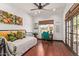 Bright bedroom with a daybed, desk area, and access to the patio, perfect for relaxing or working at 1235 N Sunnyvale -- # 113, Mesa, AZ 85205