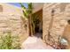 Charming courtyard entrance with desert landscaping, a decorative bicycle, and a welcoming atmosphere at 1235 N Sunnyvale -- # 113, Mesa, AZ 85205