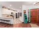 Welcoming foyer with wood flooring, a decorative rug, and a view into the kitchen at 1235 N Sunnyvale -- # 113, Mesa, AZ 85205