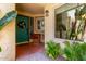 Inviting front porch with a decorative door, plants, a chair, and a cozy ambiance at 1235 N Sunnyvale -- # 113, Mesa, AZ 85205