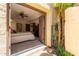 View of a main bedroom featuring carpet floors, ceiling fan, large mirror, and large glass doors to the outside at 1235 N Sunnyvale -- # 113, Mesa, AZ 85205