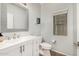 This bathroom features a modern vanity, decorative mirror, and a window for natural light at 14129 W St Moritz Ln, Surprise, AZ 85379