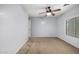 Neutral bedroom showcasing a ceiling fan and carpeted flooring at 14129 W St Moritz Ln, Surprise, AZ 85379