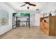 Spacious bedroom with a ceiling fan, lofted bed, and wood dresser at 14129 W St Moritz Ln, Surprise, AZ 85379