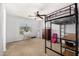 Bedroom features a loft bed, vanity and a window with natural light at 14129 W St Moritz Ln, Surprise, AZ 85379