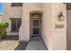 Close-up of the front entrance highlighting the security door, house number, and stucco facade at 14129 W St Moritz Ln, Surprise, AZ 85379