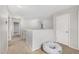 Upstairs hallway bathed in natural light with a white baby support pillow at 14129 W St Moritz Ln, Surprise, AZ 85379