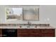 Stainless steel kitchen sink with a window view of the backyard area at 14129 W St Moritz Ln, Surprise, AZ 85379