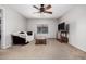 Cozy living room featuring a sofa, coffee table, and a television at 14129 W St Moritz Ln, Surprise, AZ 85379