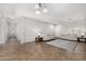 Spacious living room with tile floors, two sofas, and ample space for entertaining guests at 14129 W St Moritz Ln, Surprise, AZ 85379