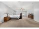 Large main bedroom with carpet flooring, ceiling fan, and neutral color scheme at 14129 W St Moritz Ln, Surprise, AZ 85379