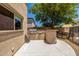 Outdoor kitchen with stainless steel grill and counter space, perfect for entertaining guests at 14129 W St Moritz Ln, Surprise, AZ 85379