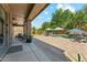 Relaxing backyard oasis with covered patio, swimming pool, lush greenery, and outdoor seating at 14364 W Cameron Dr, Surprise, AZ 85379