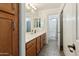 Bright bathroom featuring a large vanity with plentiful storage and a separate shower and toilet area at 14364 W Cameron Dr, Surprise, AZ 85379